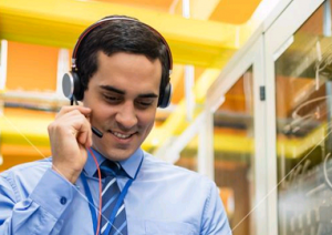 Image of technical support man with headphones